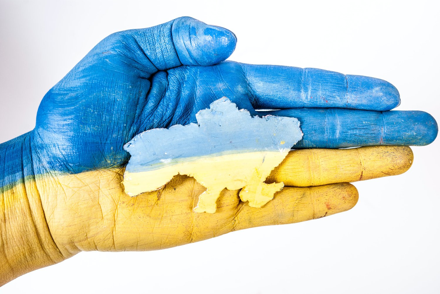 A hand painted with the colors of the Ukrainian flag